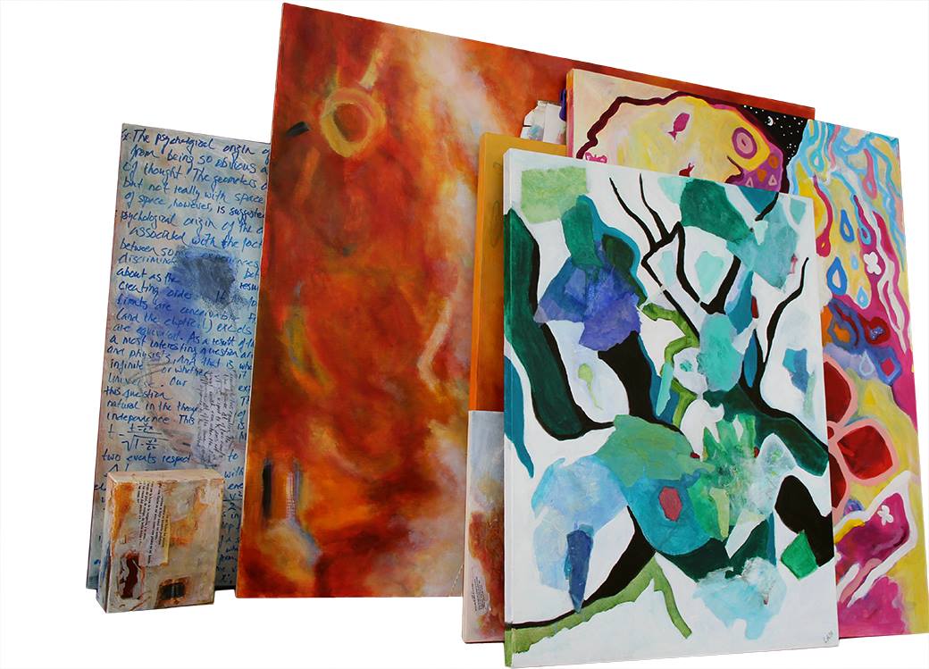 A stack of finished canvases leaning together, from the handwritten Relativity painting to colourful abstract works
